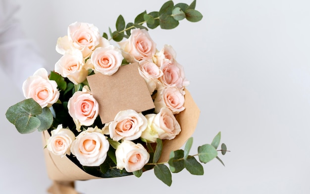 Close up hands holding flowers bouquet