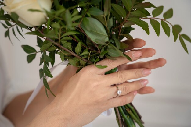 Close up hands holding flowers bouquet