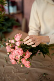 Close up hands holding flowers