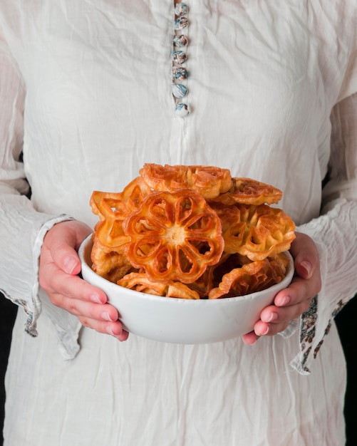 Close-up hands holding food plate