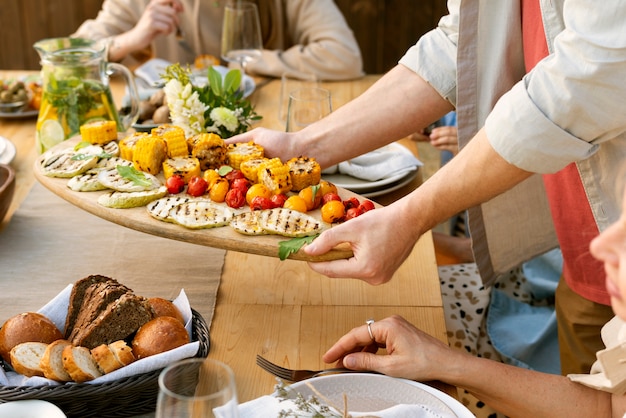 Close up hands holding food platter