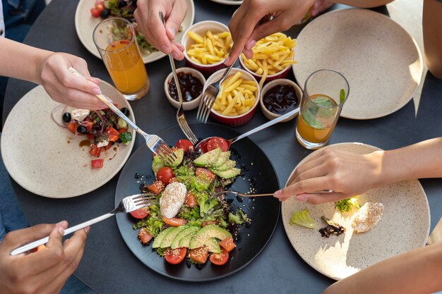 Close up hands holding forks