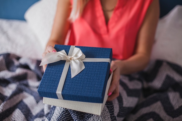 Close-up of hands holding a gift