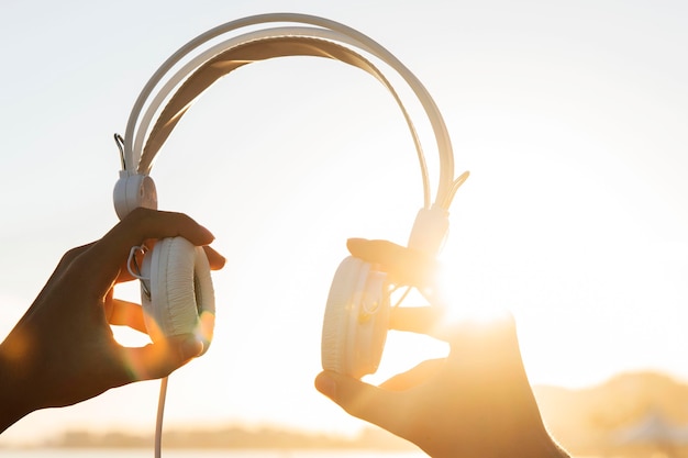 Close-up hands holding headphones