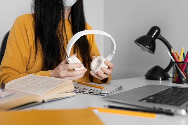 Free photo close up hands holding headphones