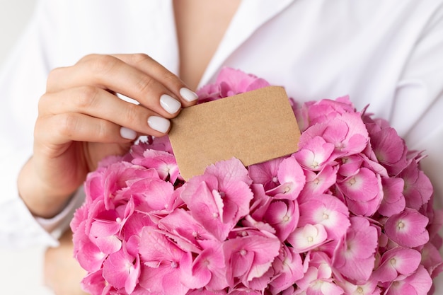 Close up hands holding hydrangea bouquet