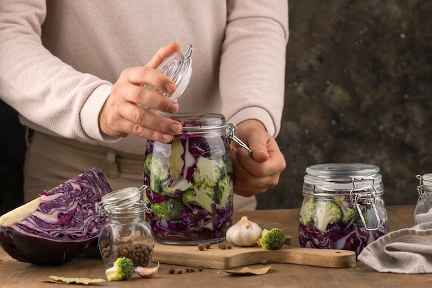 Free photo close up hands holding jar