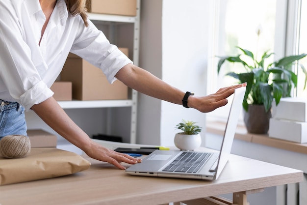 Close up hands holding laptop