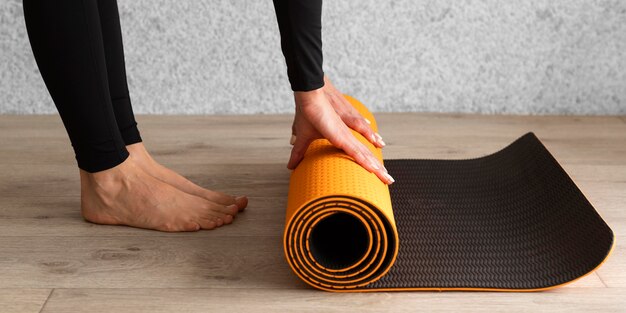 Close-up hands holding mat