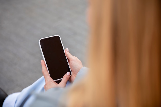 Close up hands holding phone