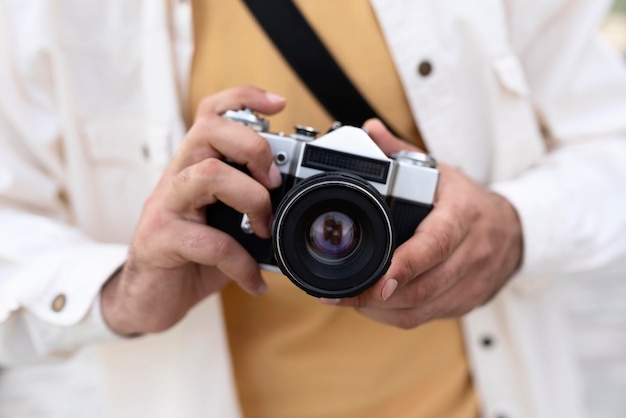 Close up hands holding photo camera