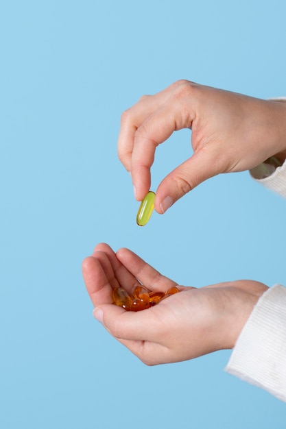 Close up hands holding pills