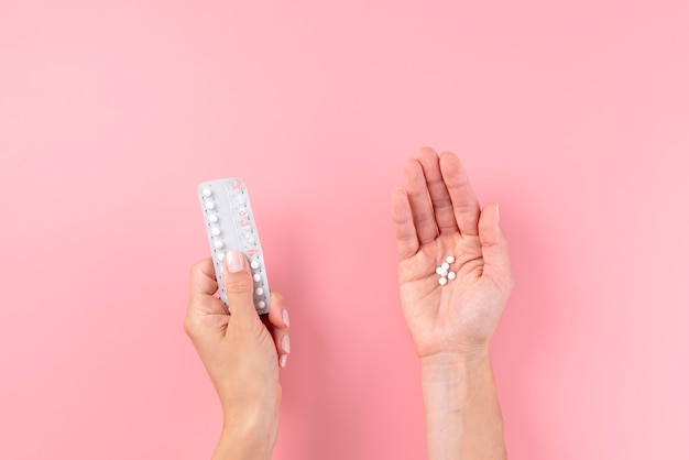 Close up hands holding pills