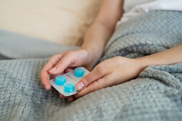 Close up hands holding pills