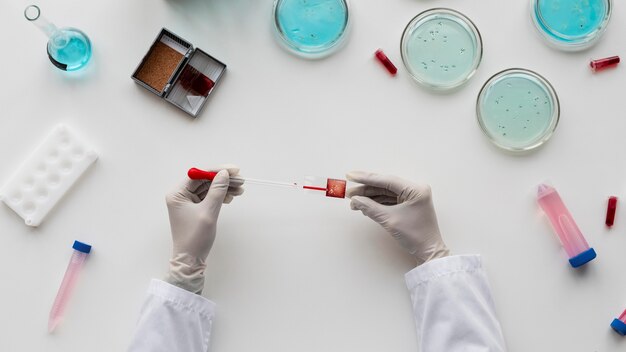 close up  hands holding pipette