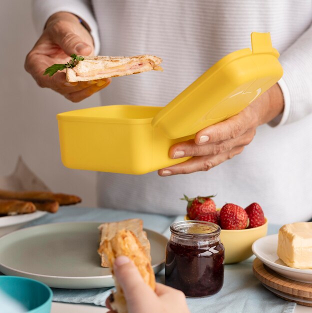 Close up hands holding sandwich