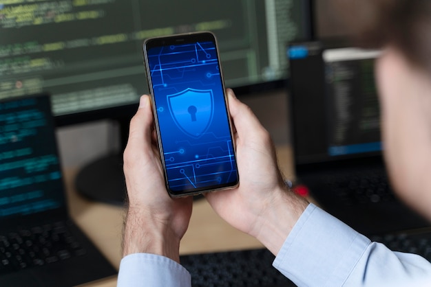 Close up hands holding smartphone with lock