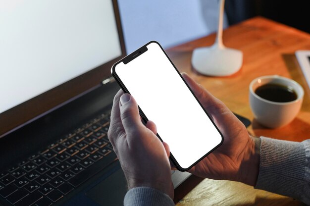 Close-up hands holding smartphone