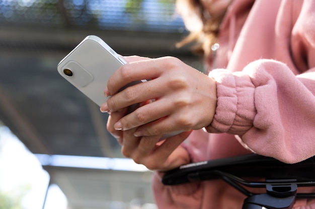 Free photo close up hands holding smartphone