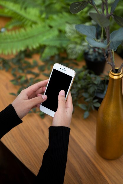 Close up hands holding smartphone