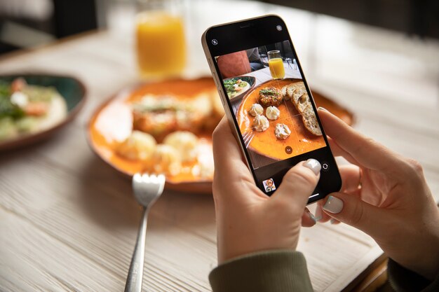 Close up hands holding smartphone