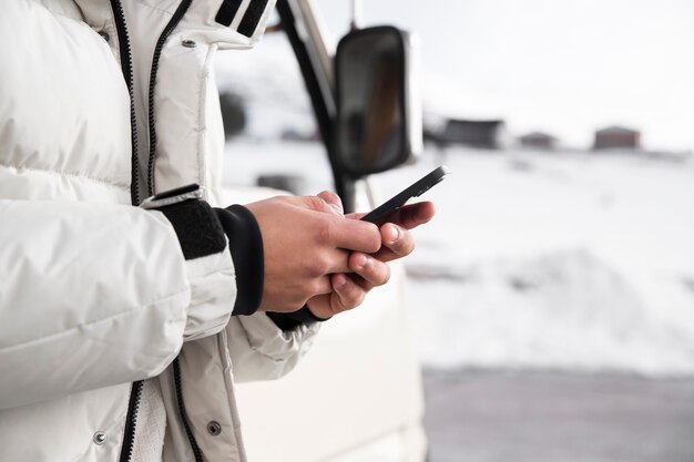 Close up hands holding smartphone