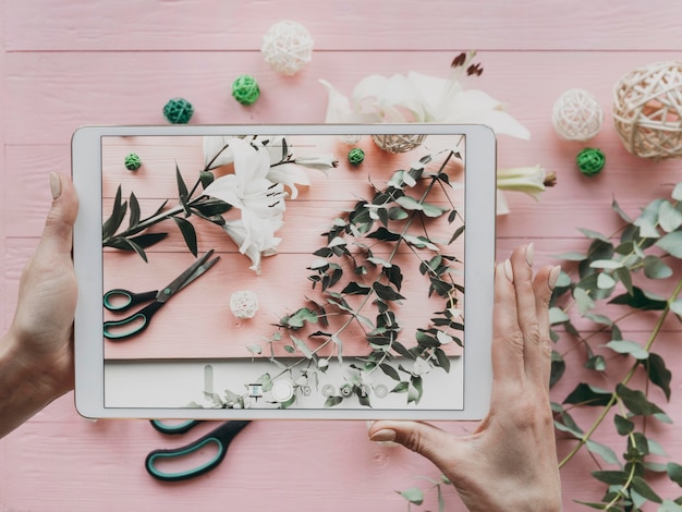 Close-up hands holding tablet