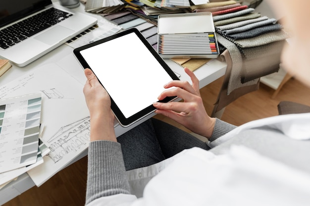 Close up hands holding tablet