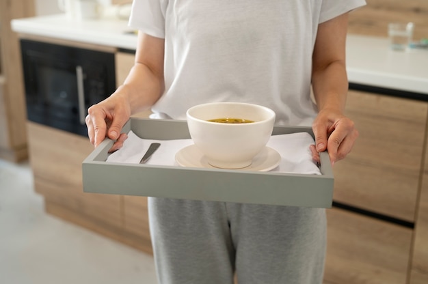 Close up hands holding tray