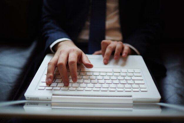 Close-up of hands on the keyboard