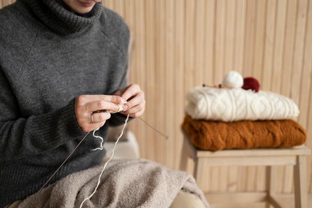 Close up hands knitting at home