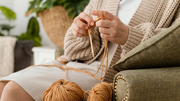 Close-up hands knitting with needles