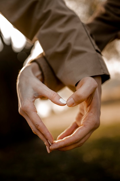 Close-up hands making heart shape