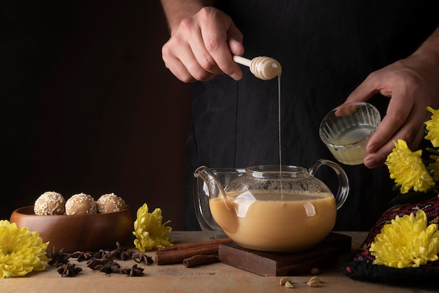 Close up hands making indian drinks