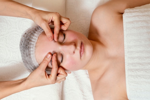 Close up hands massaging face