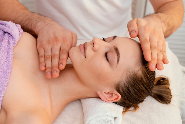Close up hands massaging woman