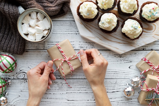 Close up hands packing gift