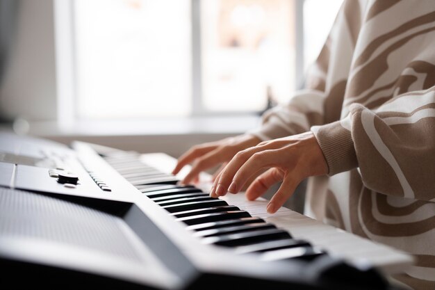 Close up hands playing the piano