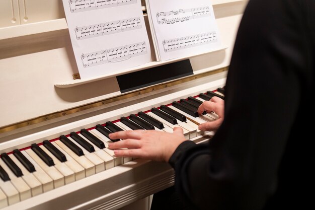 Close up hands playing the piano