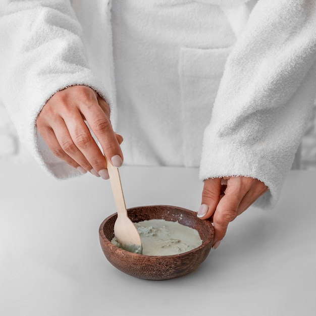 Close-up hands preparing remedy at home