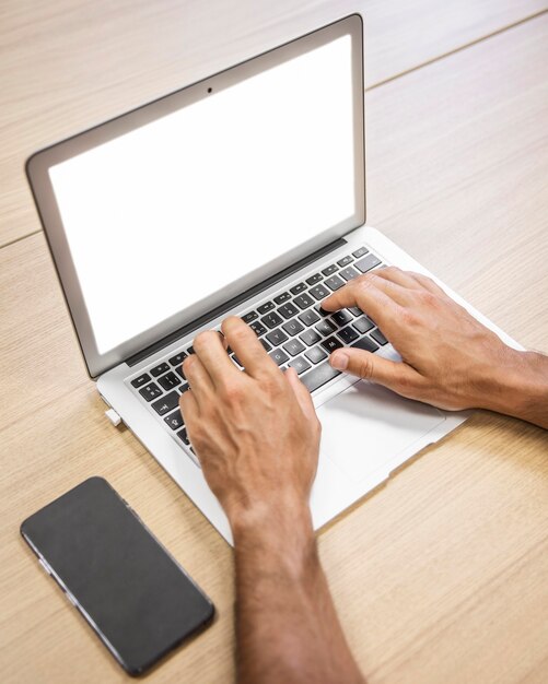 Close-up hands typing on keyboard