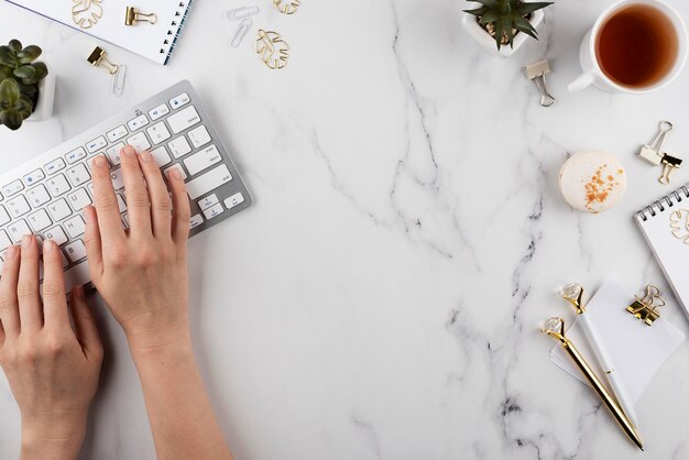 Close up hands typing on keyboard