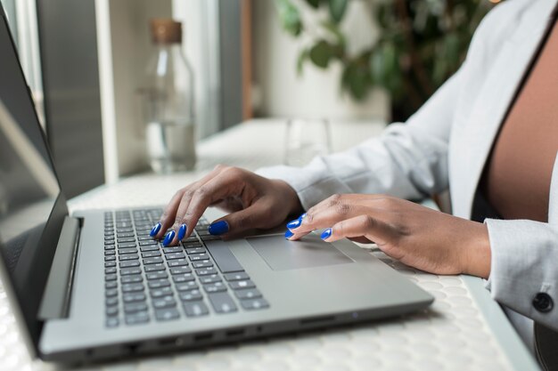 Close up hands typing on keyboard