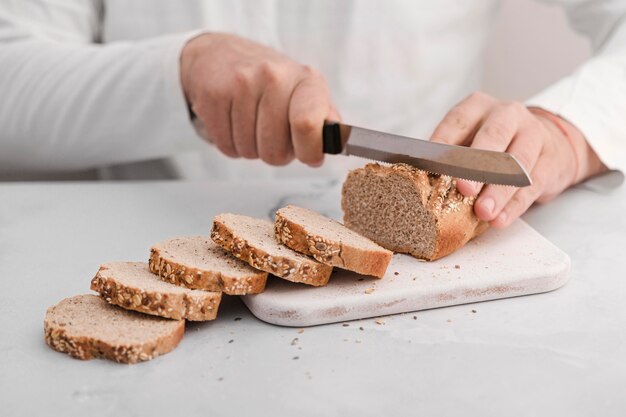 Close-up hands using knife