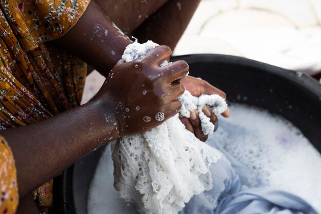 Close-up hands washing laundry