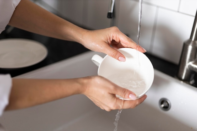 Close up hands washing mug