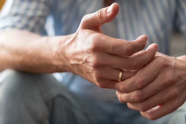 Close-up hands with golden ring