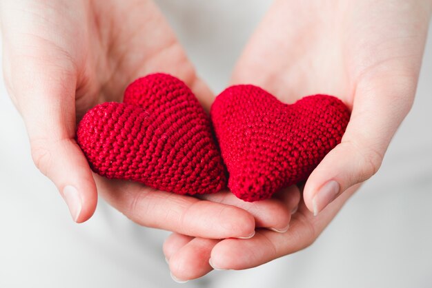 Close-up hands with hearts