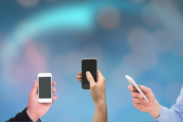 Close-up of hands with smartphones