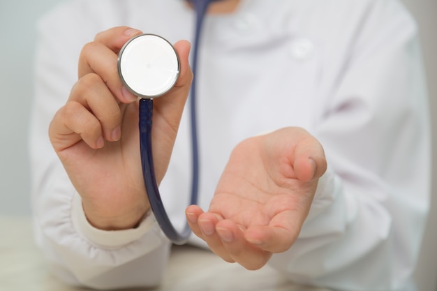 Close-up of hands with stethoscope